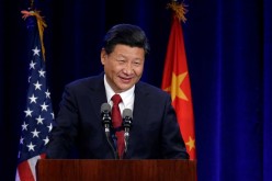 China’s Xi seeks to reassure on cybercrime, stock market