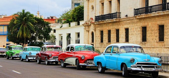 How can US businesses and investors track improvement of the business climate in Cuba?